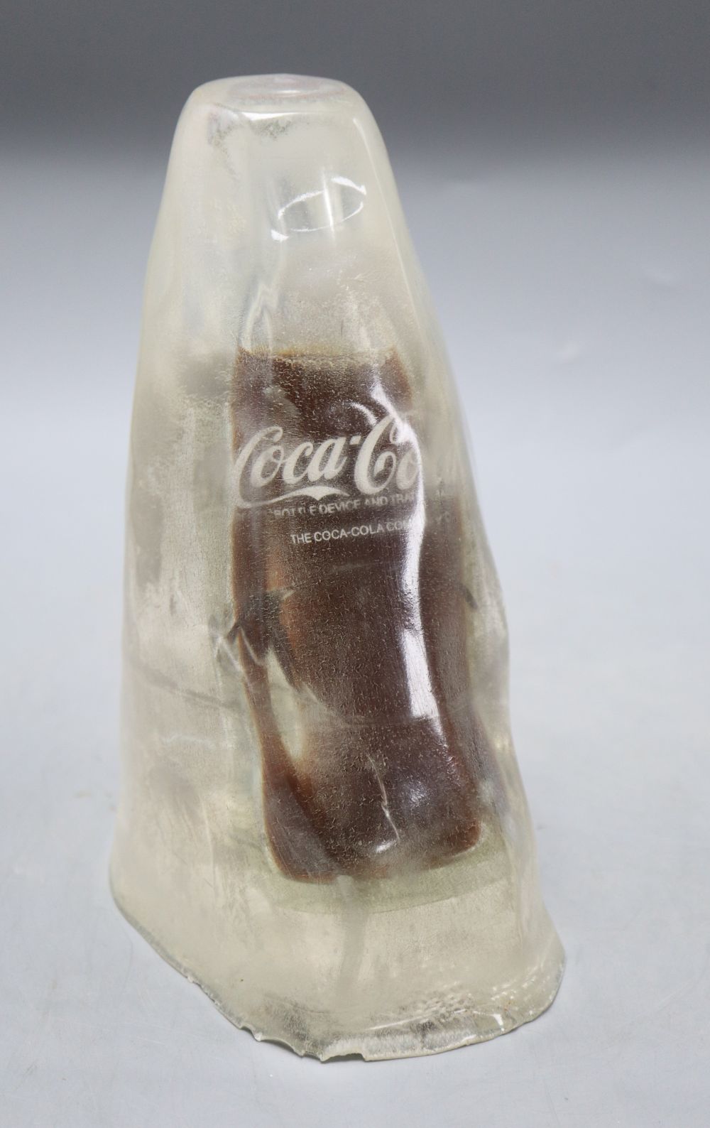 A novelty Coke bottle in ice, height 21cm